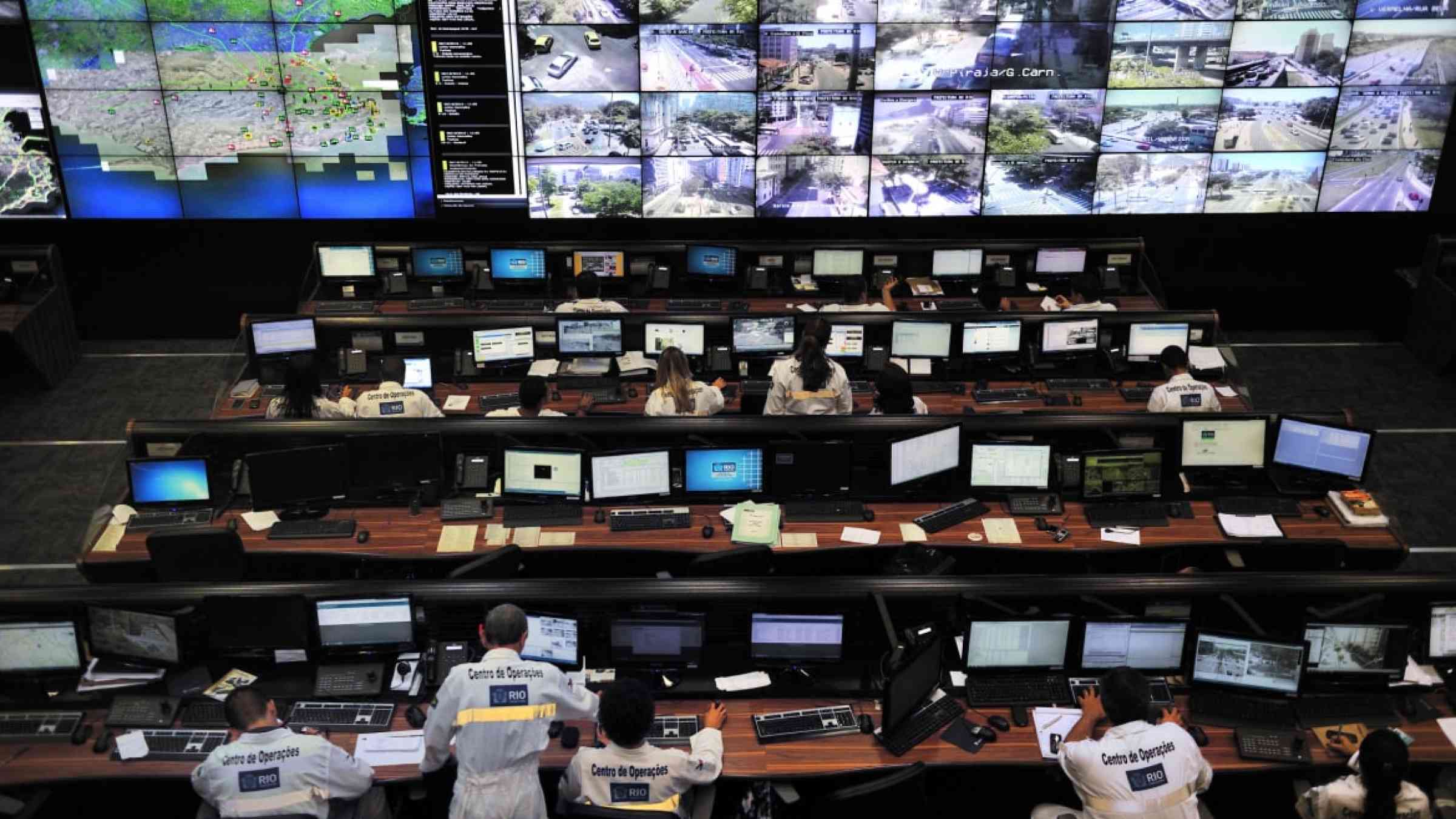 Emergency operation center with lots of desks and monitors.