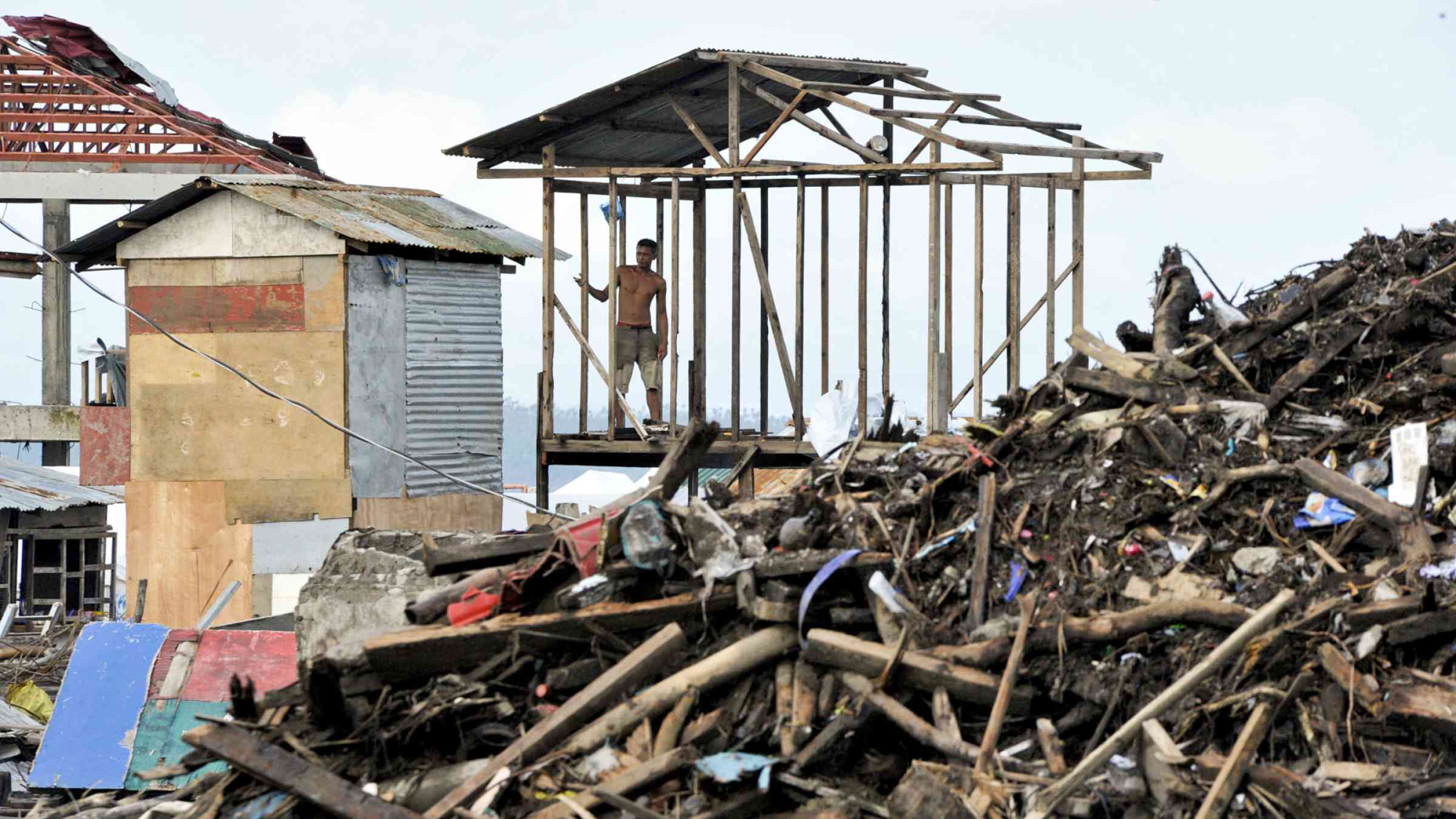 Man overviewing earthquake scene